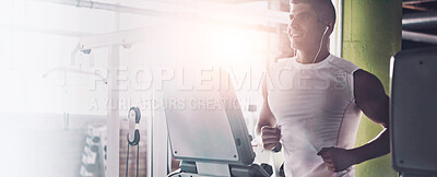 Buy stock photo Shot of a young man working out alone in the gym