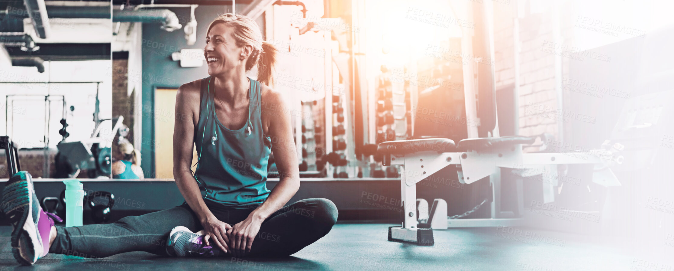 Buy stock photo Shot of a sporty woman working out at the gym