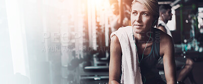 Buy stock photo Shot of a young woman working out on her own in the gym