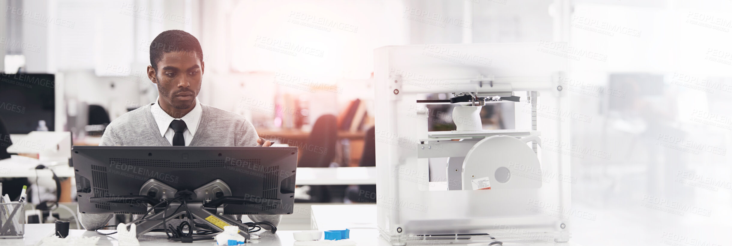 Buy stock photo Cropped shot of a young man printing his designs on a 3D printer