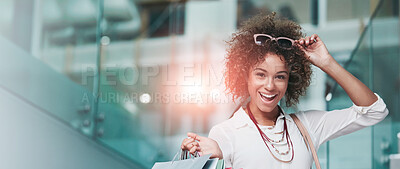 Buy stock photo Portrait of an attractive young woman on a shopping spree at the mall