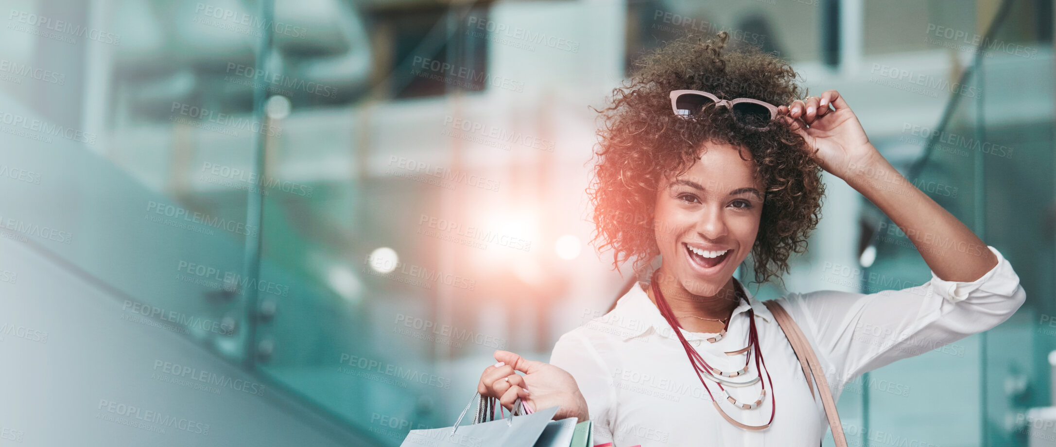 Buy stock photo Portrait of an attractive young woman on a shopping spree at the mall