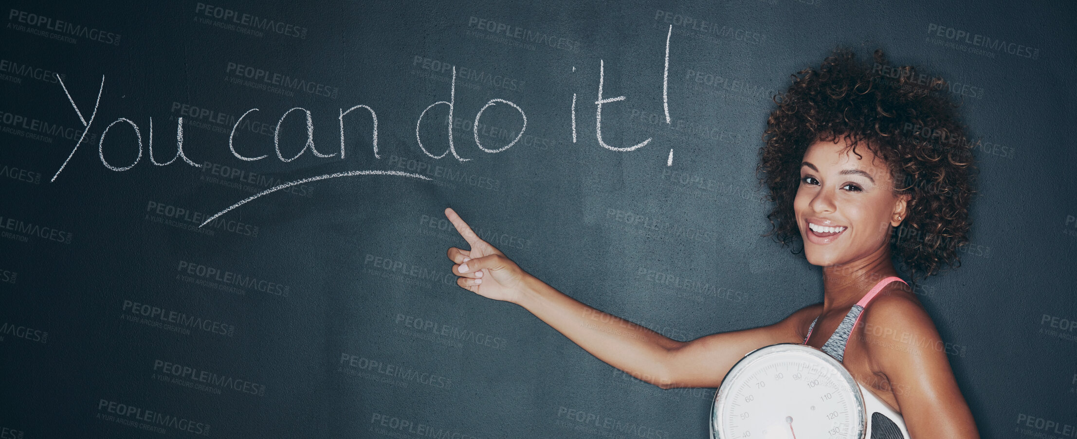 Buy stock photo Shot of a woman holding a scale against a chalk background with a motivational message