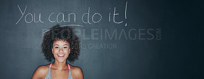 Buy stock photo Portrait of a sporty young woman measuring her waist against a grey background