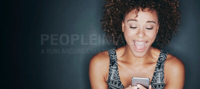 Buy stock photo Studio shot of a happy woman looking at her phone