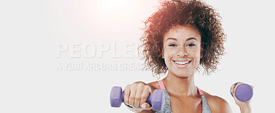 Buy stock photo Studio shot of a fit young woman lifting weights against a white background