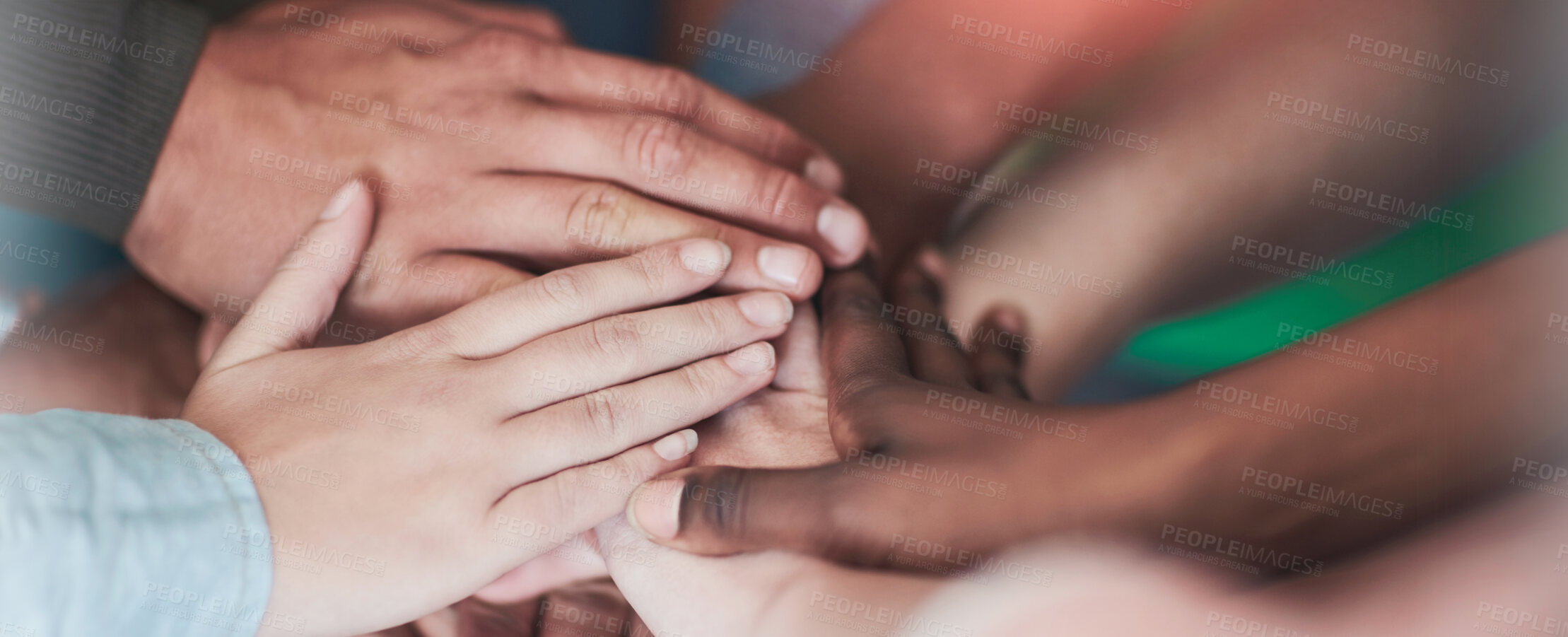 Buy stock photo High angle shot of university students' hands in a huddle