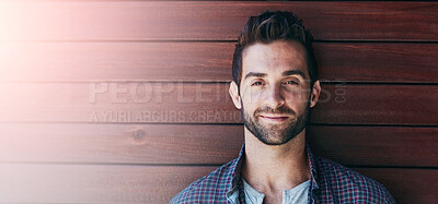 Buy stock photo Portrait of a handsome man standing against a wooden wall