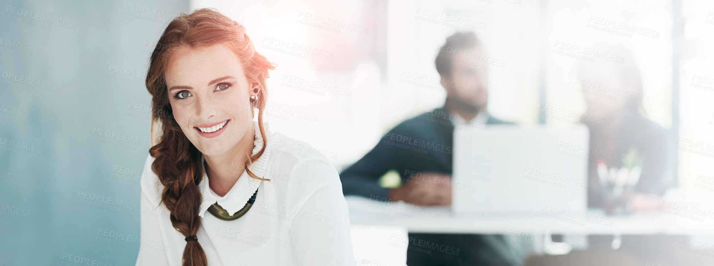 Buy stock photo Portrait of a young businesswoman working in an office with colleagues in the background