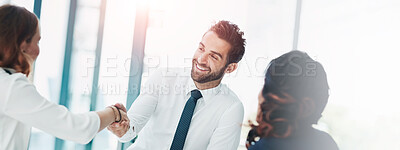 Buy stock photo Cropped shot of businesspeople shaking hands in an office