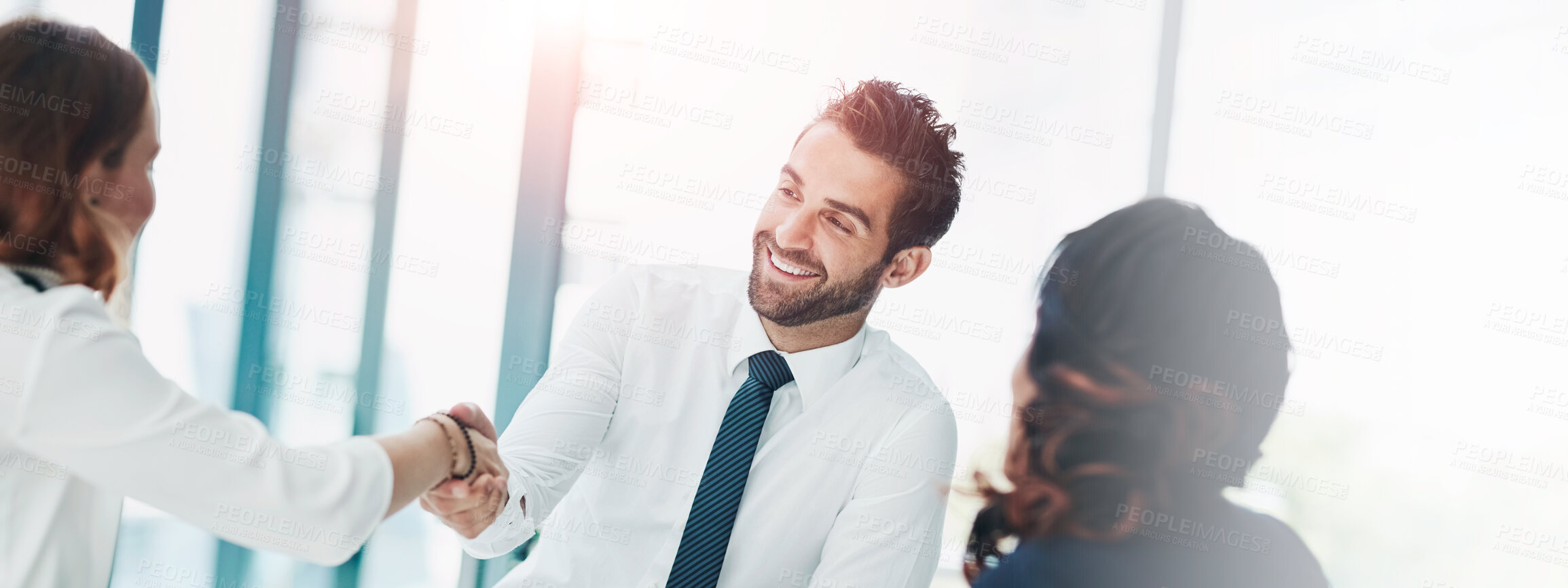 Buy stock photo Cropped shot of businesspeople shaking hands in an office