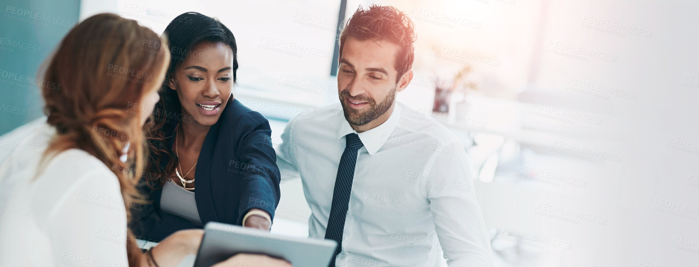 Buy stock photo Cropped shot of a young couple meeting with their advisor in an office