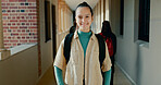 Happy, hallway and portrait of girl at academy with backpack for learning, studying or knowledge. Smile, teenager and student from Portugal in corridor of school for education class with scholarship.