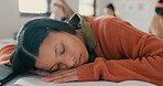 Tired, nap and student on desk in classroom at school with fatigue in lesson for learning. Burnout, rest and girl teenager sleeping for exhaustion with education, learning or studying for exam.