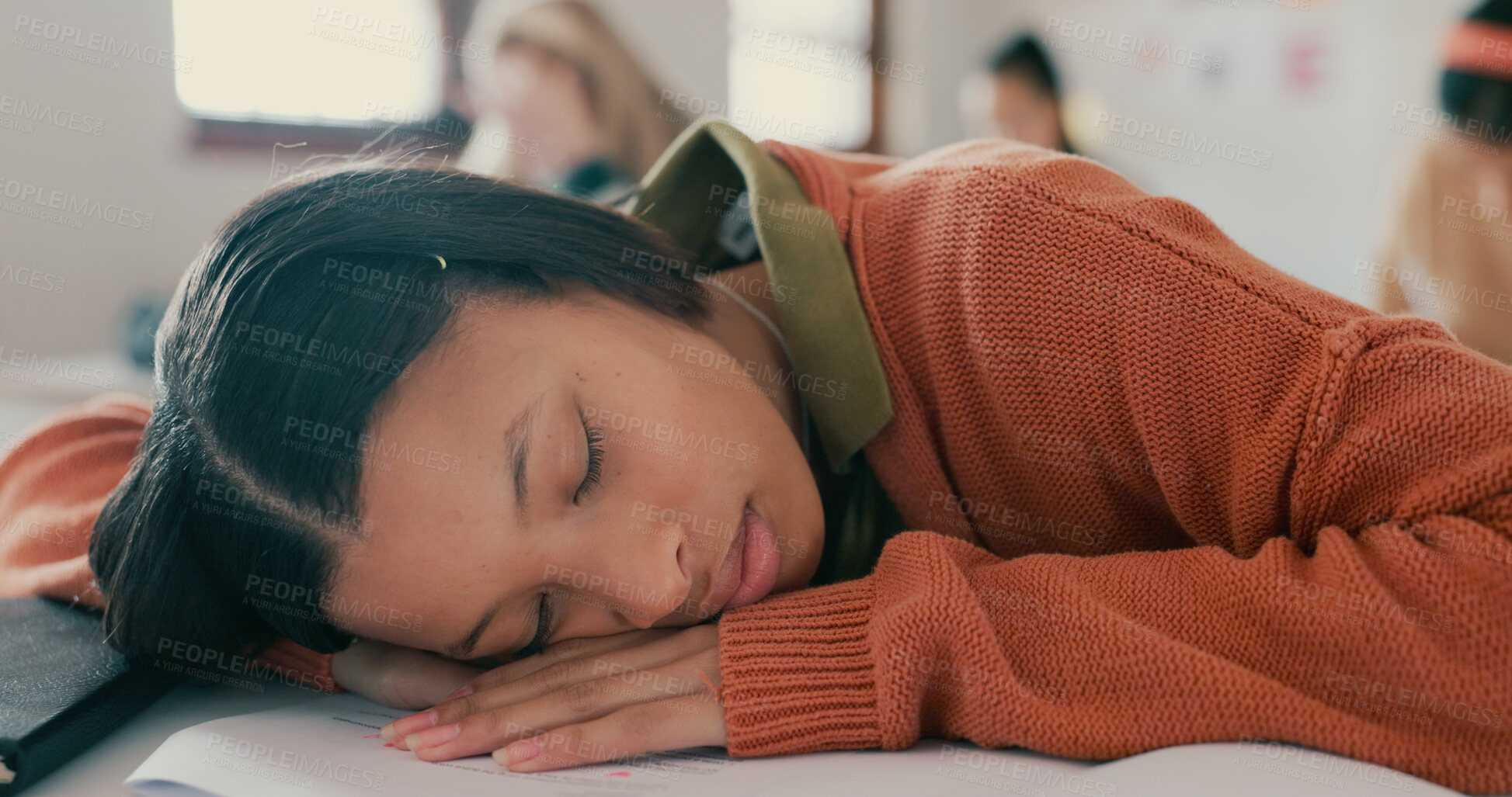 Buy stock photo Tired, nap and student on desk in classroom at school with fatigue in lesson for learning. Burnout, rest and girl teenager sleeping for exhaustion with education, learning or studying for exam.