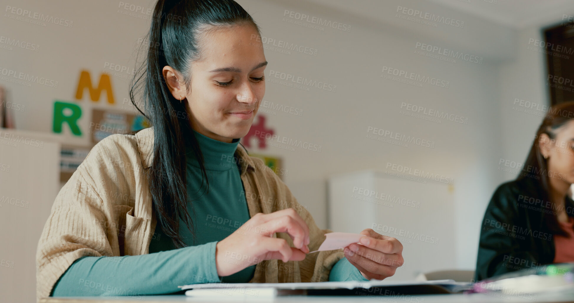 Buy stock photo Note, message and education with girl in classroom for learning, secret and scholarship. Letter, knowledge and future with student and paper in high school for solution, studying and problem solving
