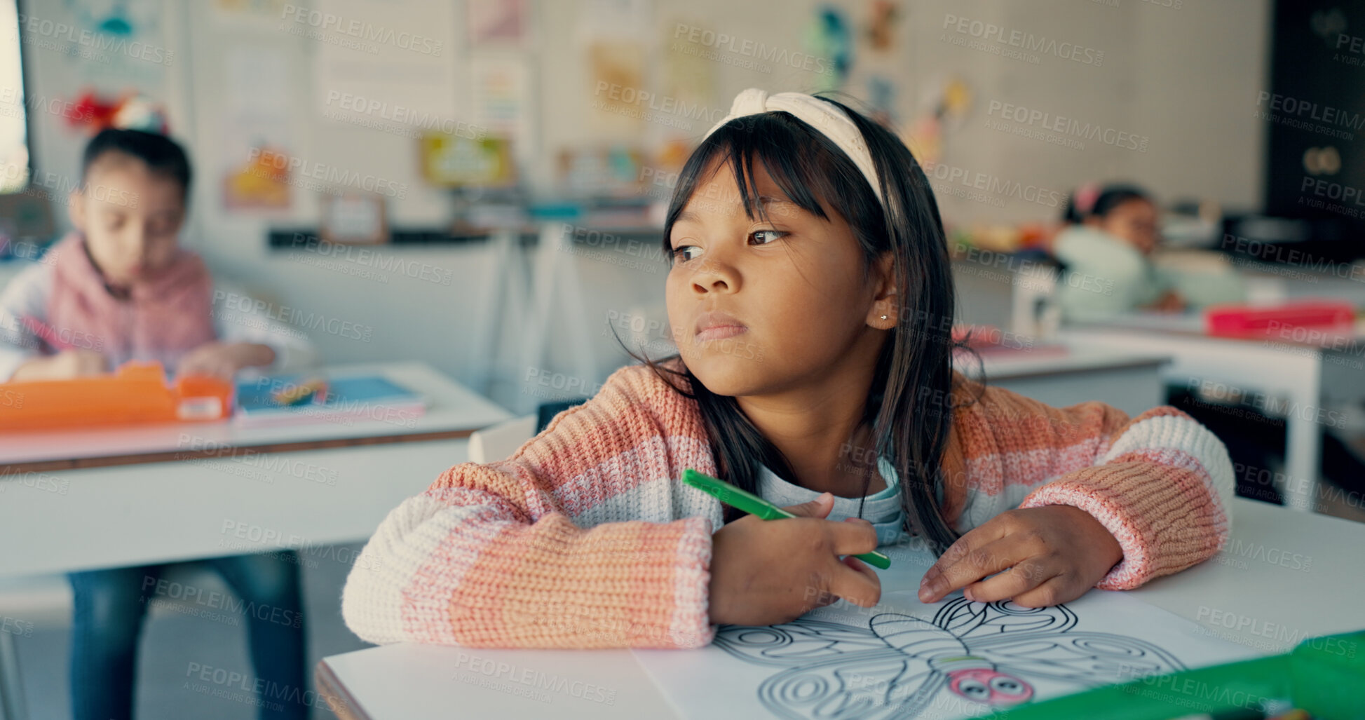 Buy stock photo Thinking, kid and girl drawing in classroom with notebook, growth and development in education. Study, desk and child with color pencil, stationery and creative learning ideas at elementary school