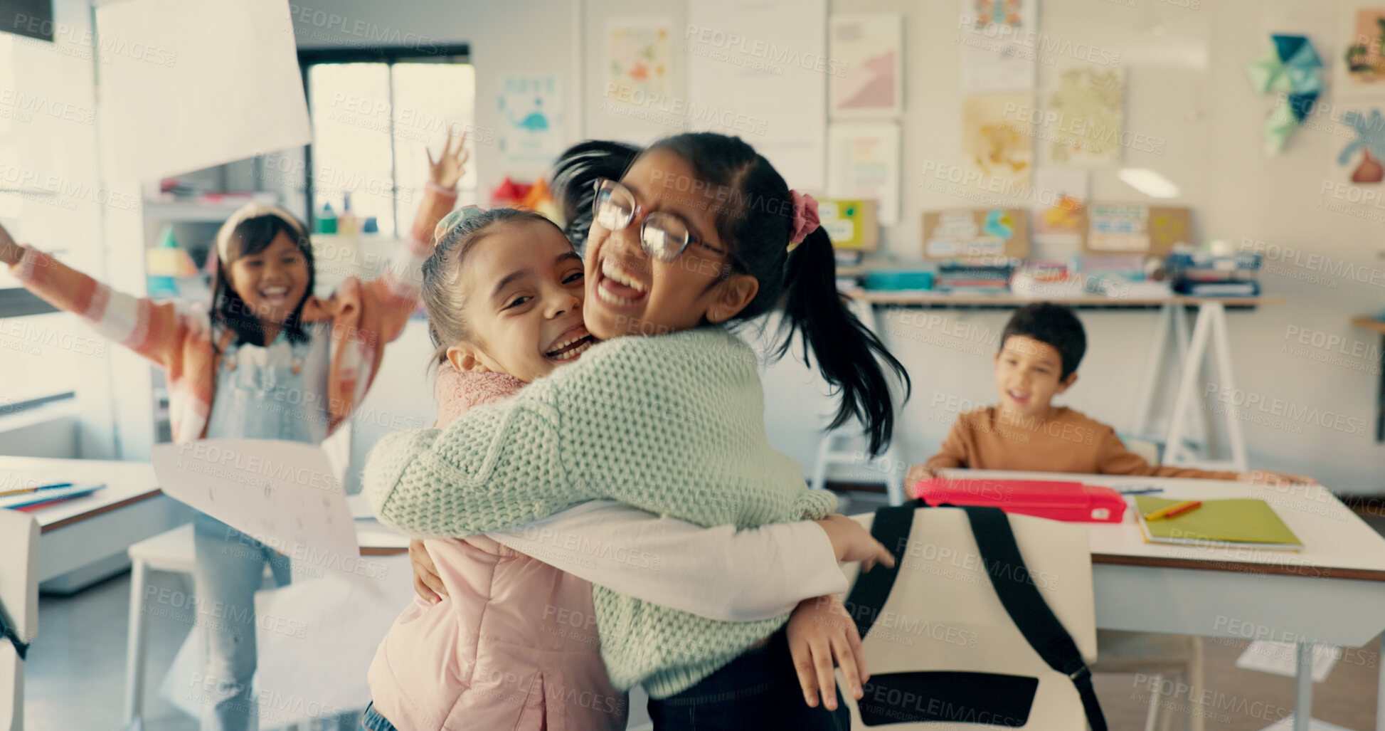 Buy stock photo Children, excited and hug at school for celebration, victory and relationship development. Kids, happy or embrace at Montessori with energy, education or students in classroom with diversity and love