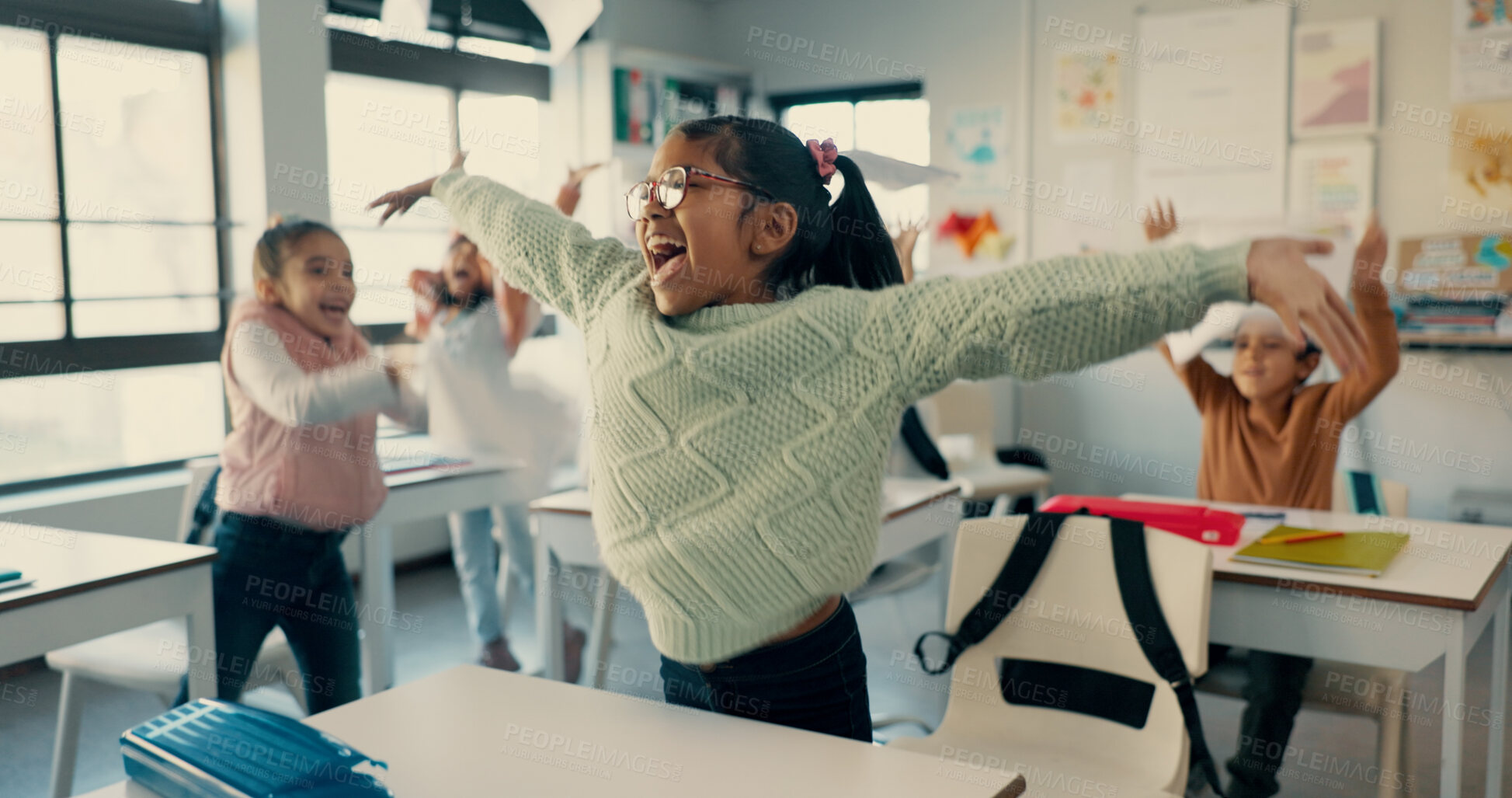 Buy stock photo Happy children, students and celebration with recess in classroom for holiday, summer or end of school semester. Young, excited and elementary kids with smile or documents in air for done or finished