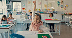 Girl, child and smile with raised hand in classroom for question, answer and happy with solution for quiz. Kid, excited and nerd for problem solving, learning and assessment for education at school