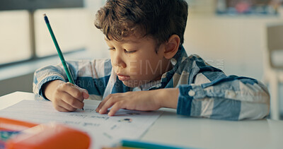 Buy stock photo Boy, child and writing notes in classroom for education, learning and assessment for progress at academy. Kid, quiz and activity for development, scholarship and thinking with language test at school