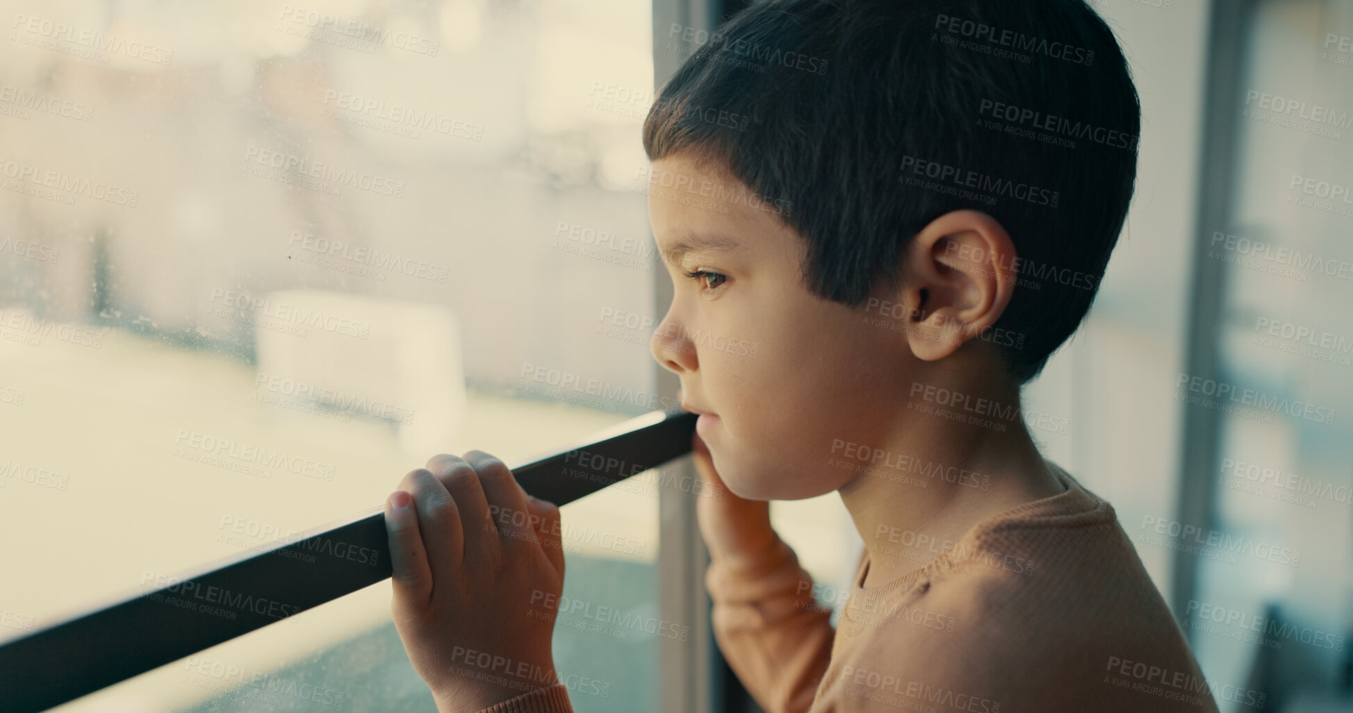 Buy stock photo Thinking, sad and boy in classroom, window and naughty kid with nostalgia, emotion and autism. School, student and childhood with view, memory and depression with mental health and anxiety