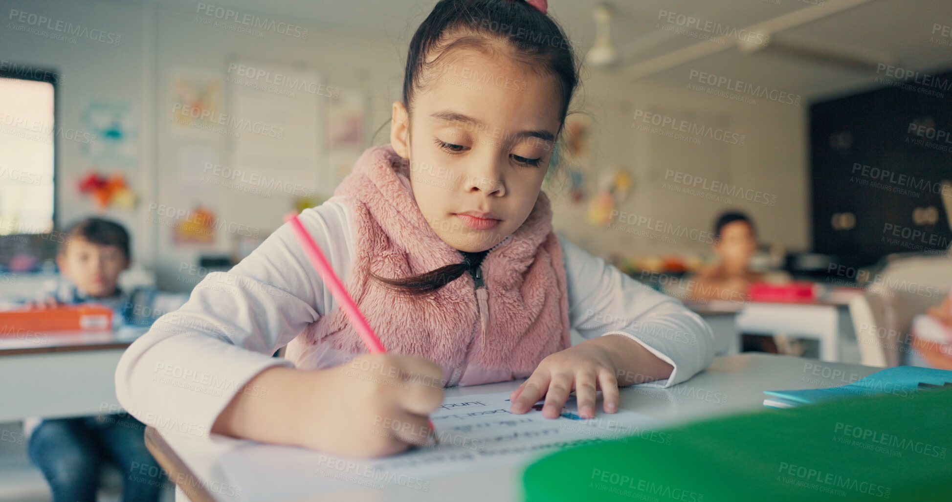 Buy stock photo Girl, child and writing with paper in classroom for education, learning and assessment for progress at academy. School kids, exam or quiz for development, scholarship or problem solving with test