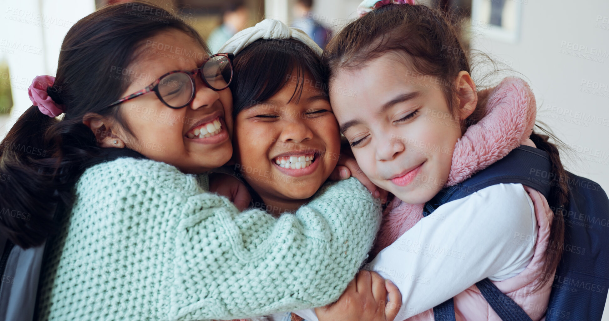 Buy stock photo Children, excited and hug at school for friendship, reunion and relationship development. Kids, happy and embrace at Montessori with energy, education and students in hallway with diversity and love