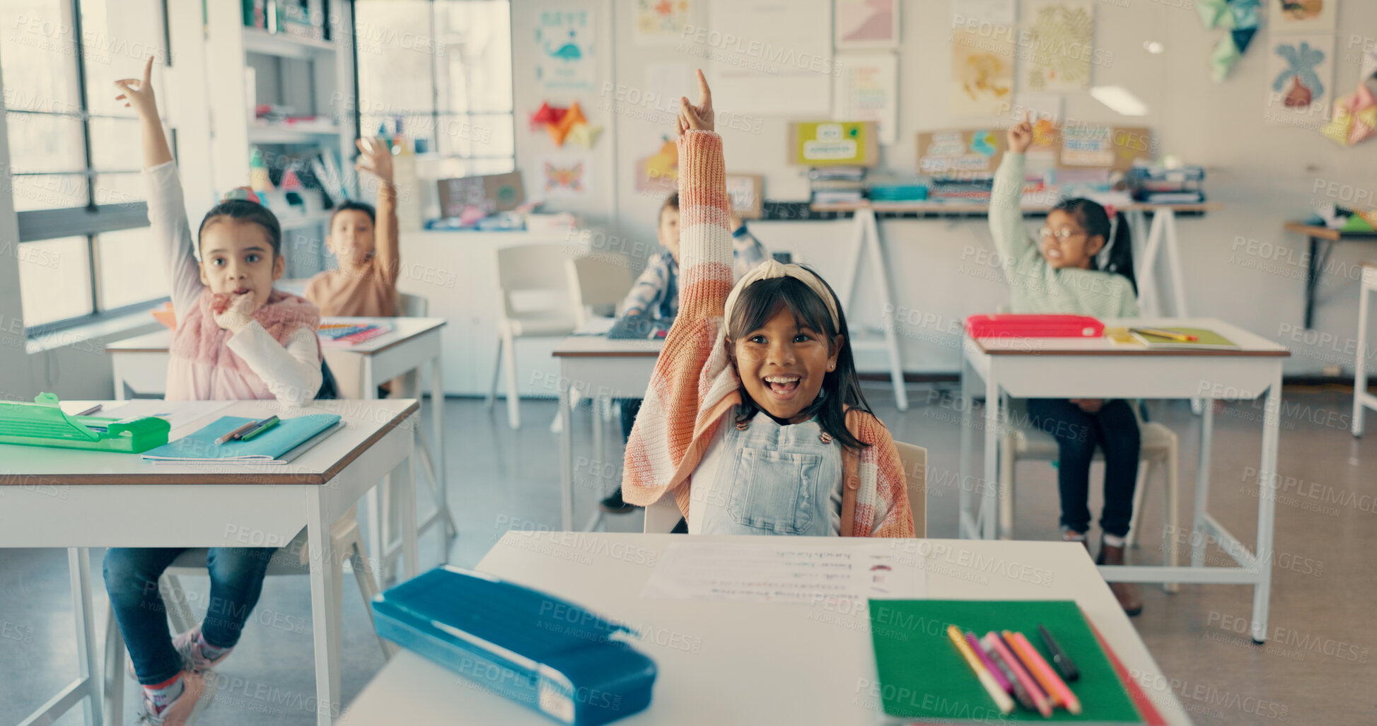 Buy stock photo Girl, child and smile with raised hand at school for question, answer and happy with solution for quiz. Kids, excited and group for problem solving, learning and assessment for education in classroom