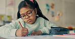 Girl, child and writing with paper at school for education, learning and assessment for progress at academy. Kid, nerd and exam for development, scholarship and thinking with problem solving in class