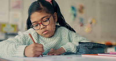 Buy stock photo Girl, child and writing with paper at school for education, learning and assessment for progress at academy. Kid, nerd and exam for development, scholarship and thinking with problem solving in class