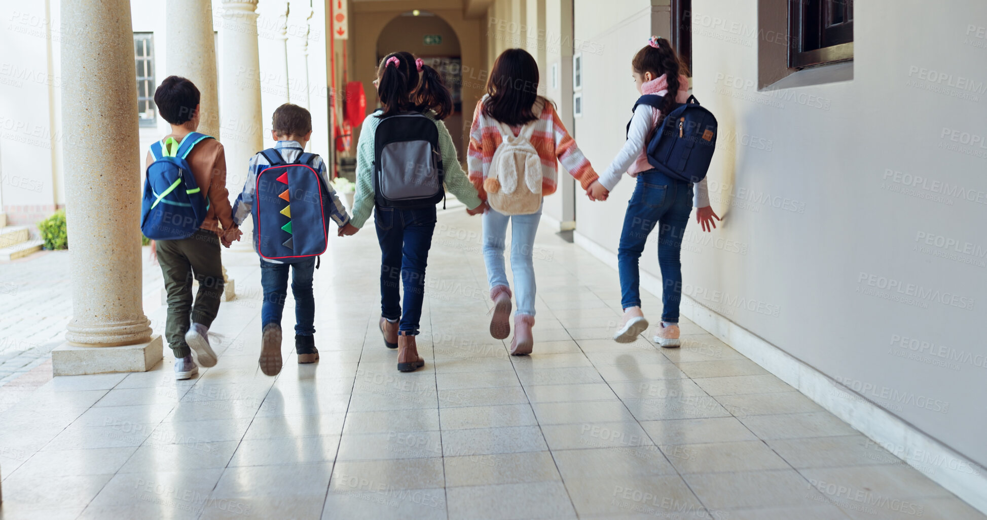 Buy stock photo Kids, holding hands and group with back at school with care, connection and support in hallway. Children, friends and together with bonding, education and development with scholarship at academy