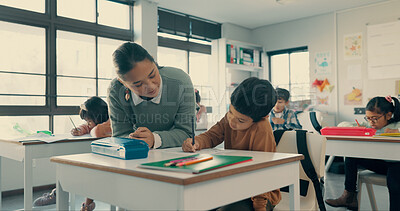 Buy stock photo Help, teacher and child in classroom with notebook, growth and creative development with education. Learning, woman and boy at desk together with support, writing and exam notes at elementary school