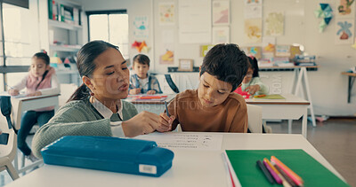 Buy stock photo Help, teacher and kid at desk in classroom with notebook, growth and child development in education. Learning, woman and boy student together with support, writing and exam notes at elementary