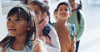 Buy stock photo Education, students and children in row outdoor for lesson, learning and back to school. Kids, girl and waiting in line by classroom with backpack for scholarship, ready for knowledge and studying