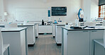 Empty, science classroom and college for education with biology room, medical research and learning practical. Medicine, equipment and interior of chemistry lab for studying, scholarship or knowledge