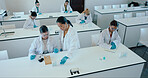 Science, students and learning in class with test tubes, PPE and lecture for higher education. Chemistry lesson, woman teacher or people in academy for experiment, lab research and studying for exams