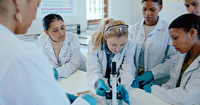 Buy stock photo Students, girl and microscope in science lab for chemistry analysis, sample study or practical lesson. High school, people and learning of medical research for experiment with ppe safety in classroom