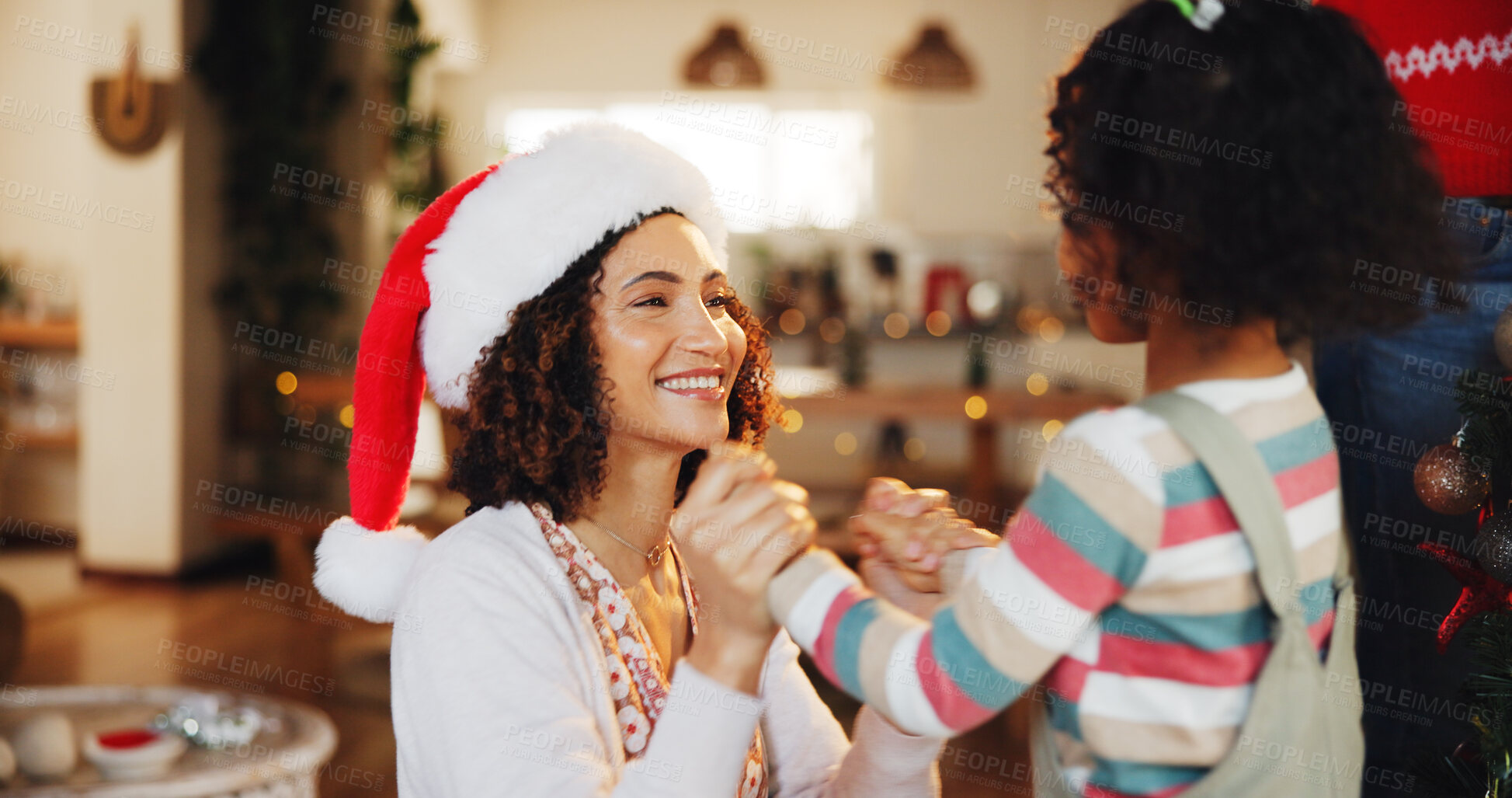 Buy stock photo Christmas, mother and girl with love, holding hands and celebration with happiness, house and festive. Xmas hat, family and parent with daughter, mama and kid with childhood, holiday and cheerful