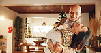 Christmas, love and couple in home dance for holiday, vacation and festive season. Love, marriage and happy man and woman laugh for celebration, bonding and tradition with decoration in living room