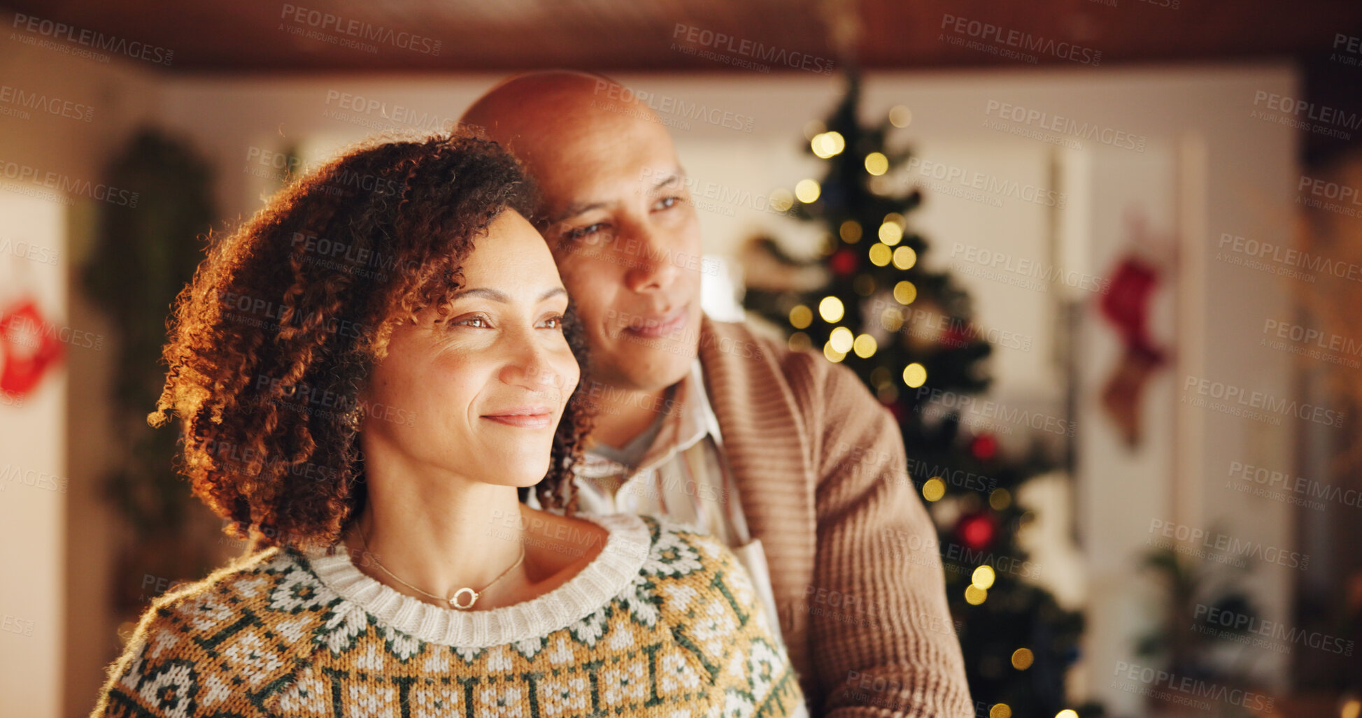 Buy stock photo Christmas, mature couple or thinking in home with love, trust or commitment in relationship. Happy man, woman or hug in living room for festive season, celebrating tradition or bonding with affection