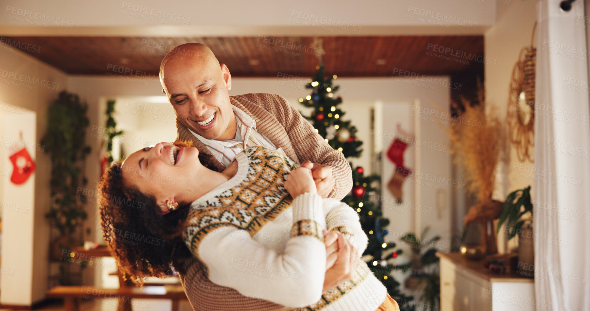 Buy stock photo Christmas, happy and couple in home dance for holiday, vacation and festive season. Love, marriage and man and woman laughing for celebration, bonding and tradition with decoration in living room