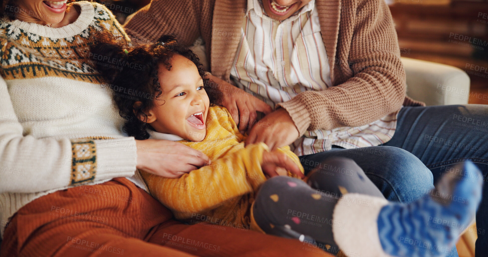 Buy stock photo Christmas, tickle and love with family on sofa for festive magic, Noel cheer and xmas celebration. Smile, winter holiday and decoration with people at home for present, vacation and laugh together