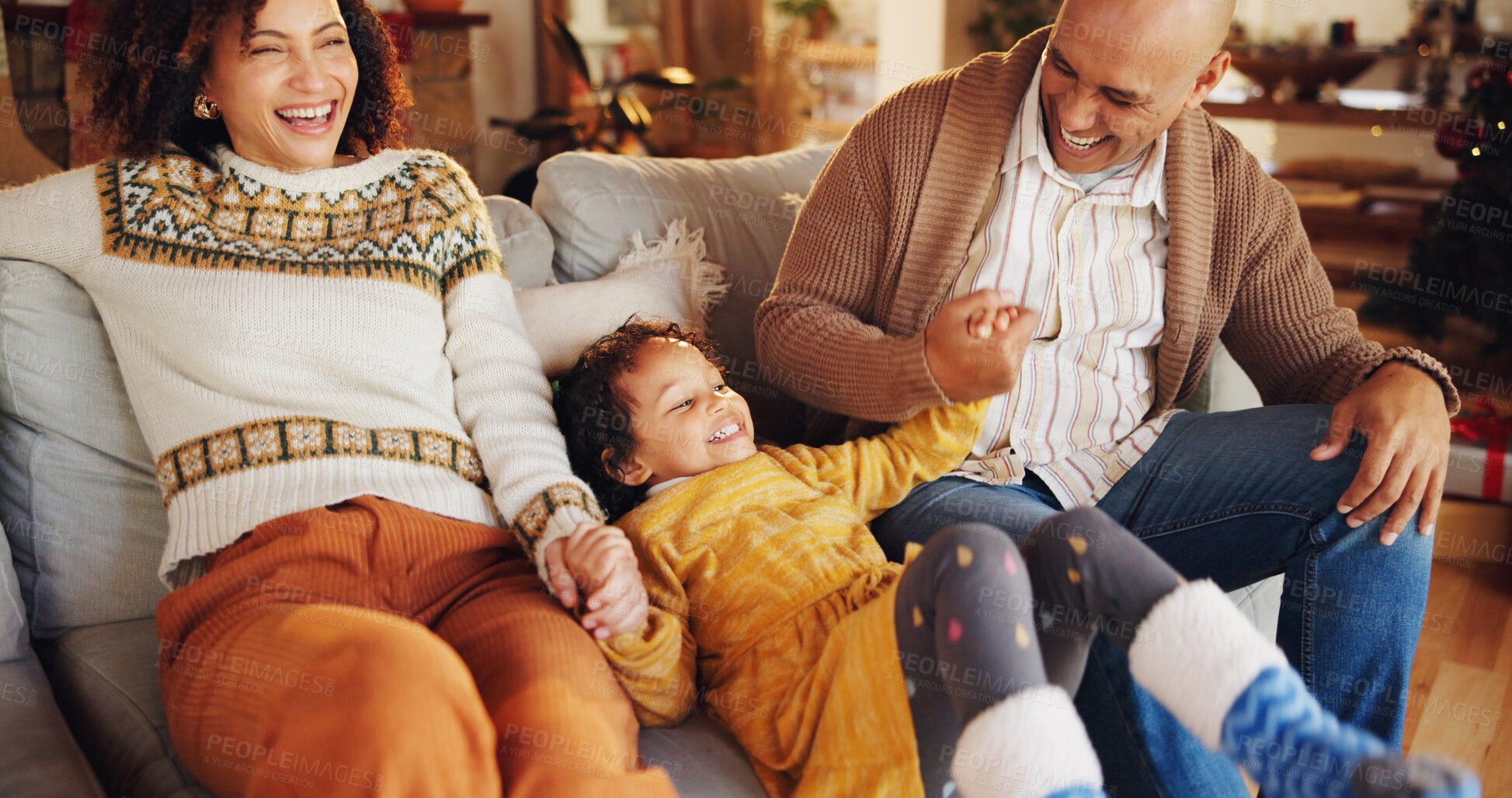 Buy stock photo Christmas, happy and love with family on sofa for festive magic, Noel cheer and xmas celebration. Smile, winter holiday and decoration with people at home for present, vacation and laugh together