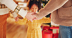 Christmas, closeup and happy with family holding hands for festive magic, Noel cheer and xmas celebration. Love, winter holiday and decorations with people at home for present, vacation or excited
