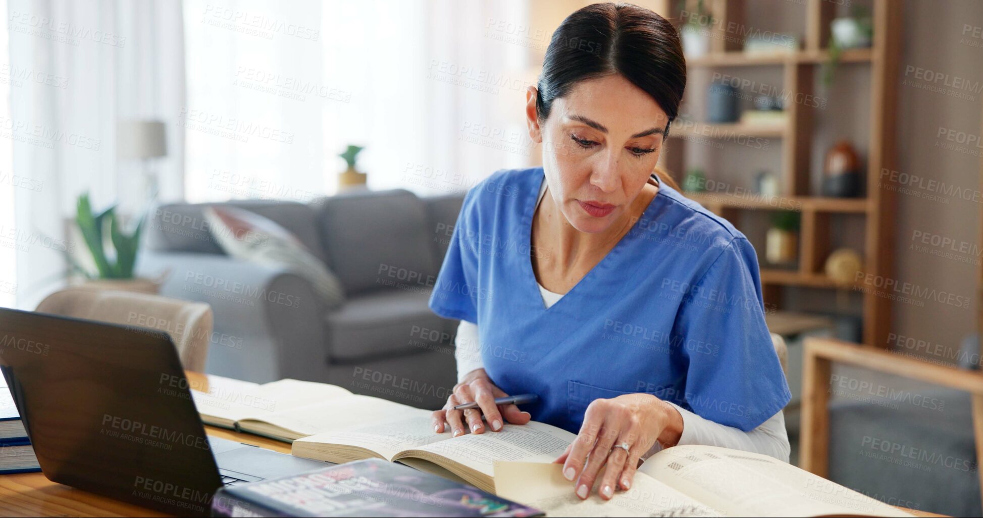 Buy stock photo Nurse, woman and studying with textbook by laptop for healthcare research, information or knowledge. Medical, work and reading with technology at desk for diagnosis reference, guide or treatment plan