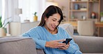 Woman, phone and smile on sofa in home with social media post, streaming subscription and online videos. Person, relax and smartphone on couch for reading ebook, dating site or browsing internet blog