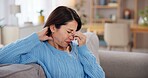 Woman, headache and stress on sofa in home with brain fog, dizzy and muscle tension. Person, migraine and uncomfortable pressure with vertigo, frustrated and overwhelmed with burnout in living room