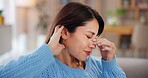 Woman, headache and stress on sofa in house with brain fog, dizzy and muscle tension. Person, migraine and uncomfortable pressure with vertigo, massage temple and overwhelmed with burnout in lounge