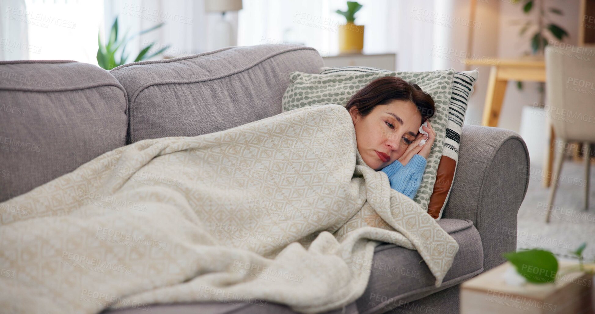 Buy stock photo Woman, sick and thinking on sofa with blanket, anxiety and falling asleep for recovery. Mature person, tired and allergies in home in flu season, break up depression and mental health burnout or sad